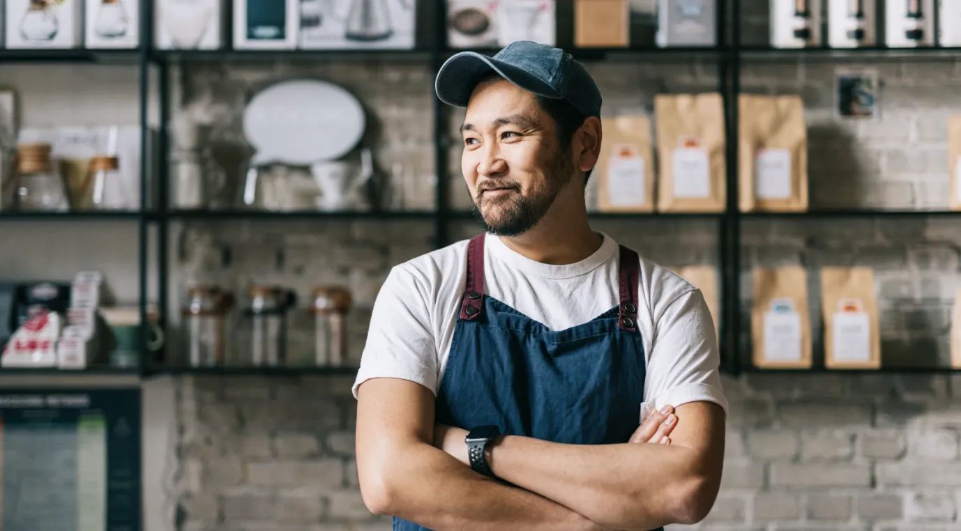 barista coffee shop owner arms crossed