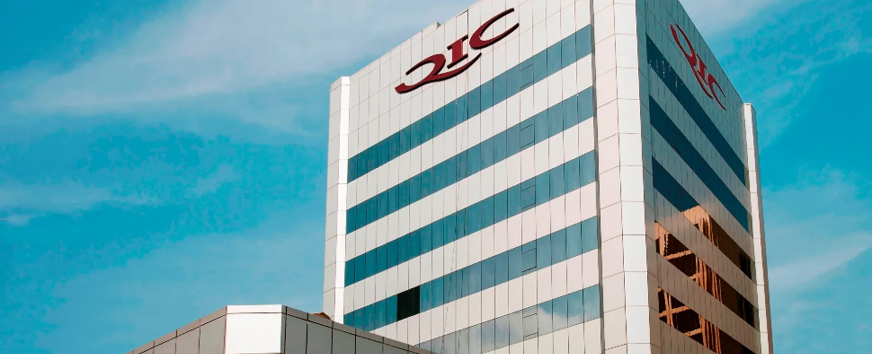 qic office tower glass blue sky